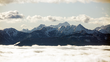 Foto von österreichischen Bergspitzen über den Wolken