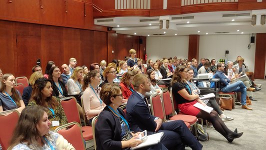 People sitting in the plenary room